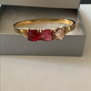 C. Wonder hinged bangle with three pink/red stones